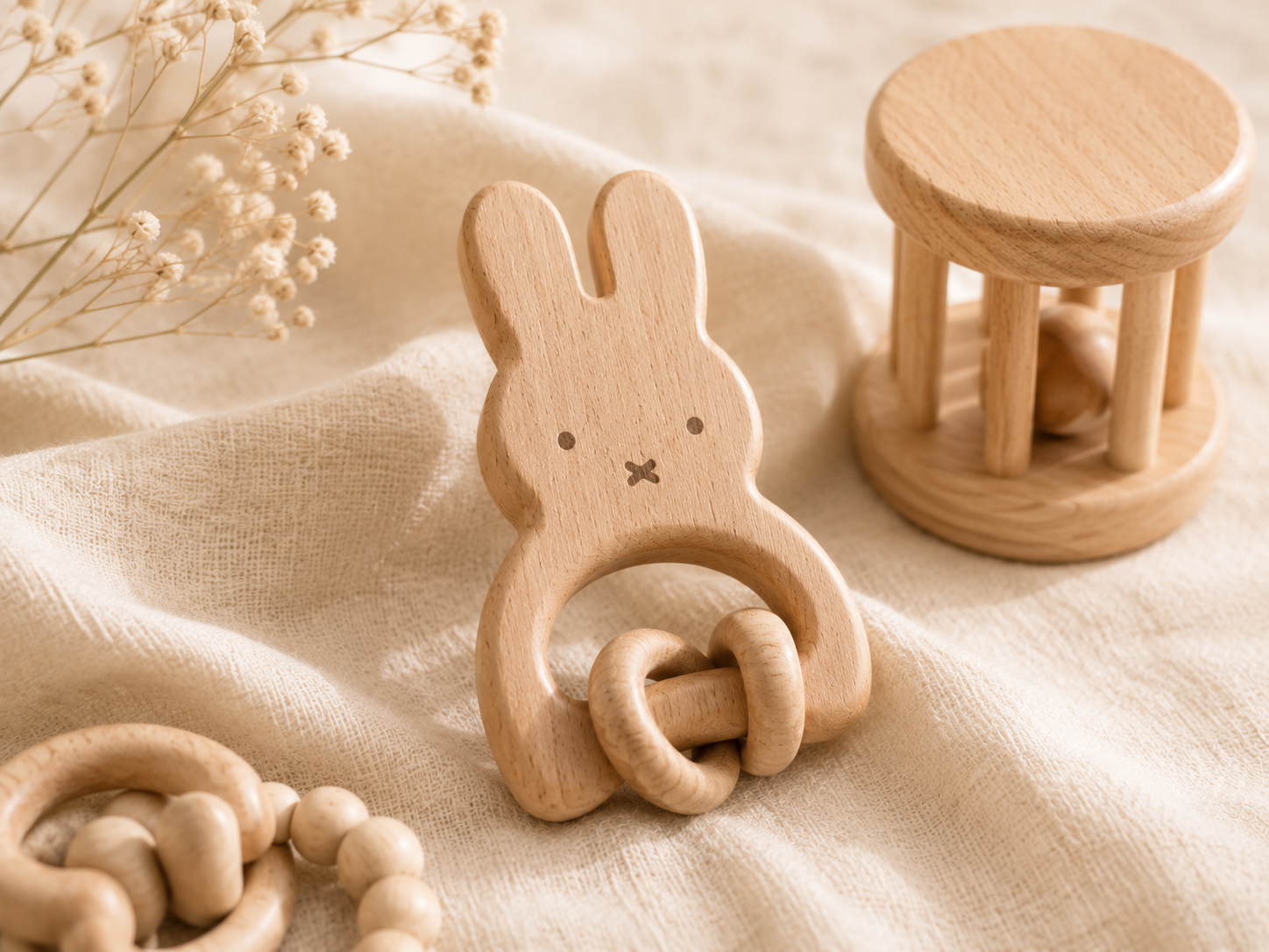 Natural wooden baby toys on linen